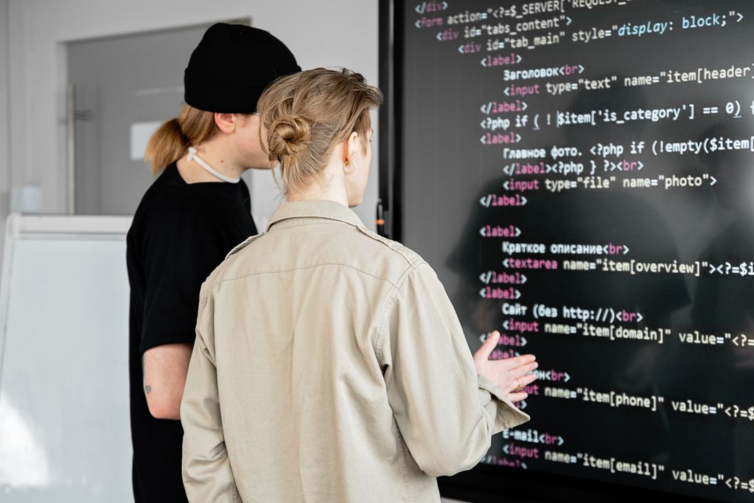 A team reviewing work on a large screen